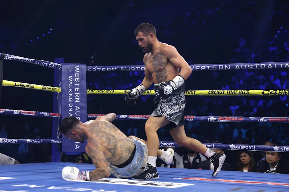 Lomachenko standing over a downed George Kambosos Jr in Australia